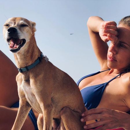 Yael and her pet dog, Aza at beach